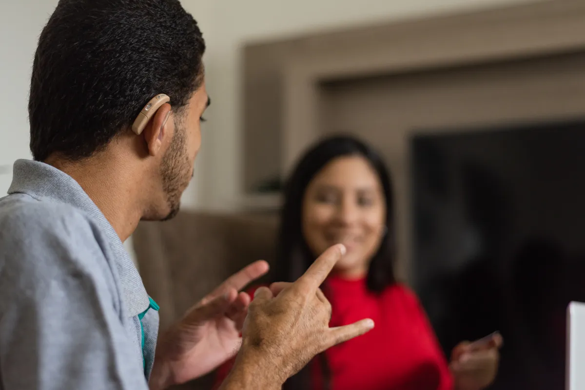 Two people in conversation in American Sign Language