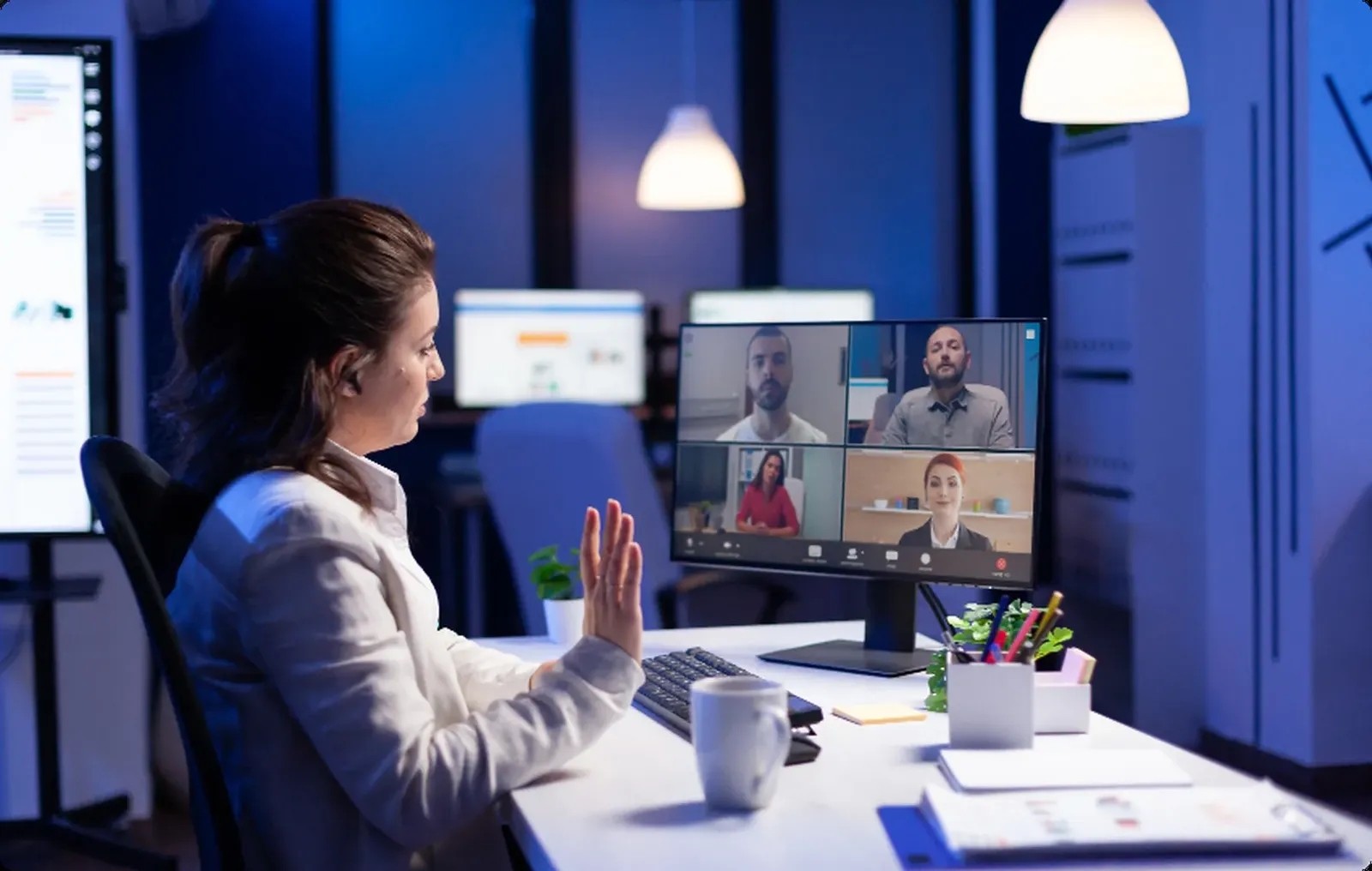 A video meeting on a laptop with participants in a grid