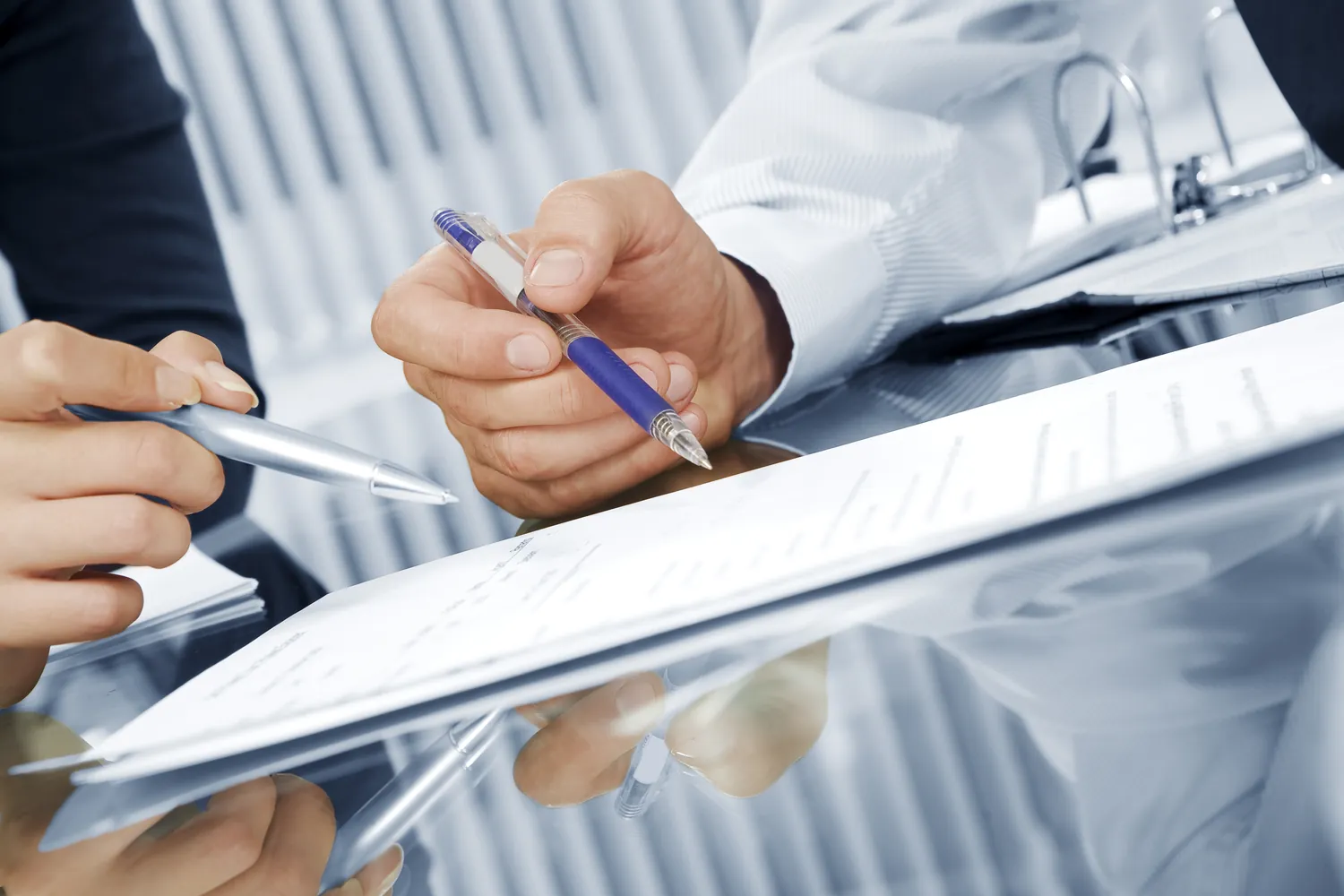 A translated document being reviewed and signed