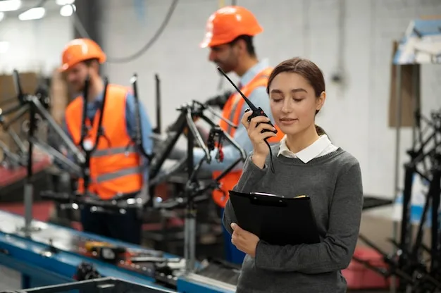 A safety lead with a clipboard and radio beside workers in protective gear