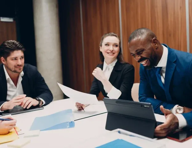 A product team reviewing a release together at a conference table