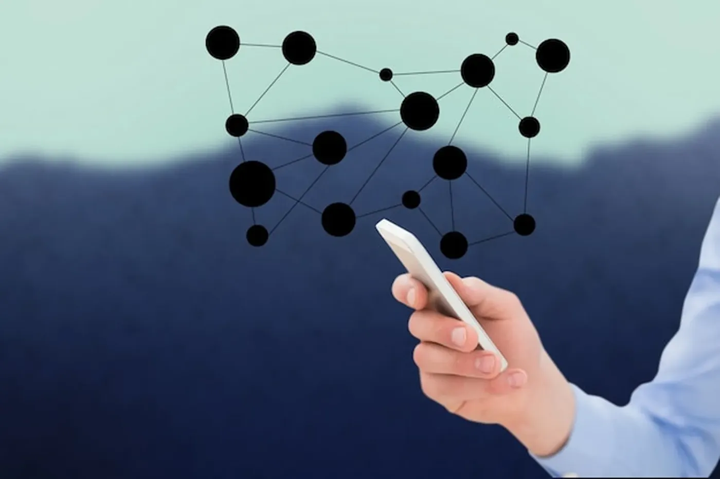 A hand holding a smartphone against a network of connected points